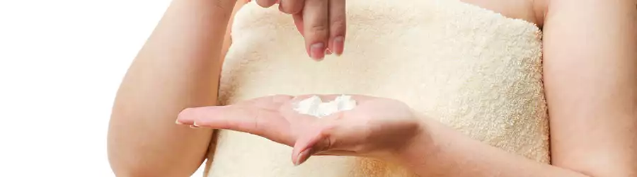 woman using talcum powder