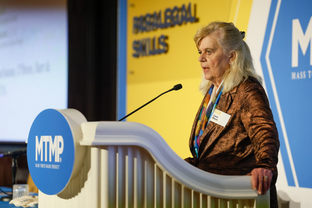 Carol Moore, chief investigator, Levin Papantnio, at MTMP Spring 2025 talking on the paralegal track